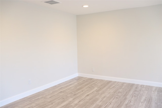 spare room featuring light hardwood / wood-style floors