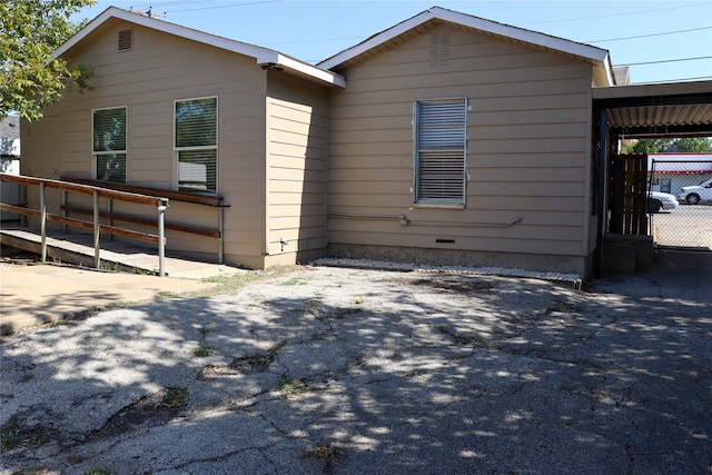 exterior space with a carport