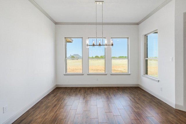 unfurnished dining area featuring ornamental molding, dark hardwood / wood-style floors, and a notable chandelier