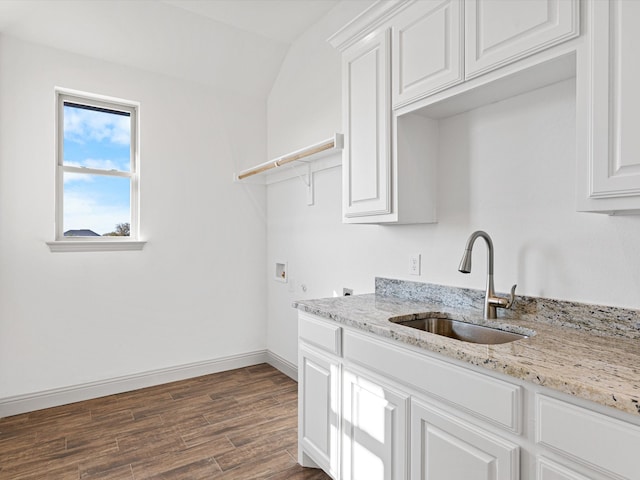 kitchen featuring sink, vaulted ceiling, white cabinetry, light stone counters, and dark hardwood / wood-style flooring