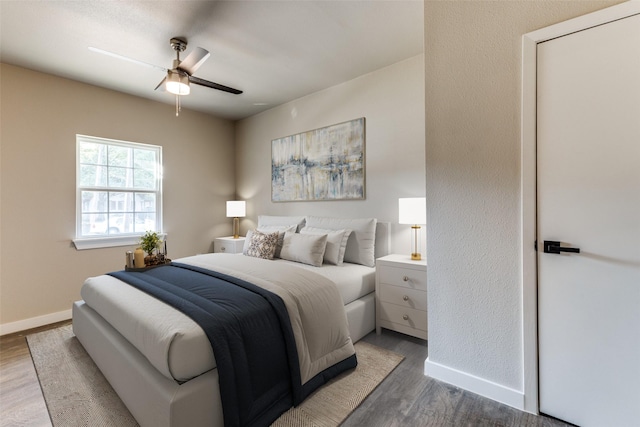 bedroom featuring ceiling fan and wood-type flooring