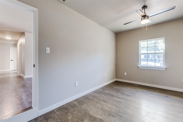 empty room with hardwood / wood-style flooring and ceiling fan