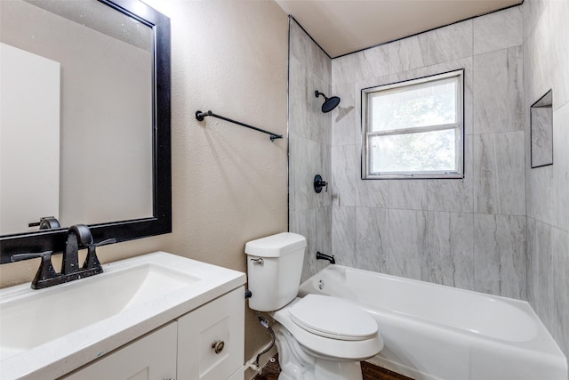 full bathroom featuring vanity, toilet, and tiled shower / bath combo