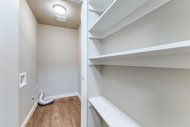 laundry area with washer hookup and hardwood / wood-style floors