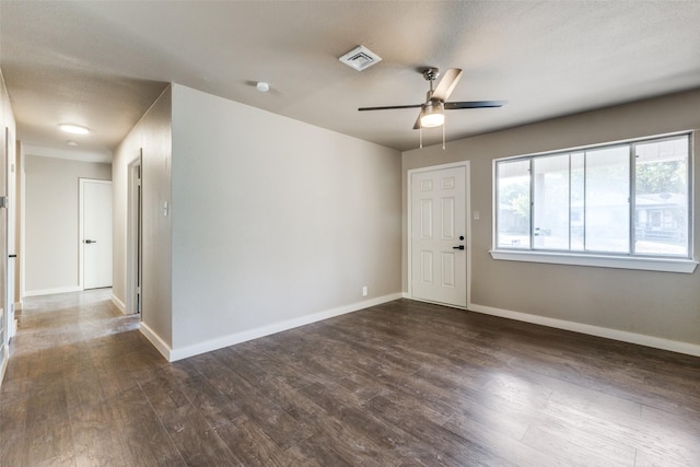 unfurnished room with ceiling fan and dark hardwood / wood-style floors