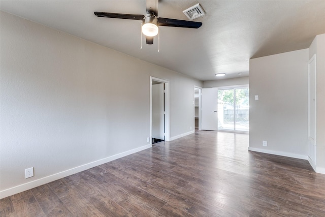 spare room featuring dark hardwood / wood-style floors and ceiling fan