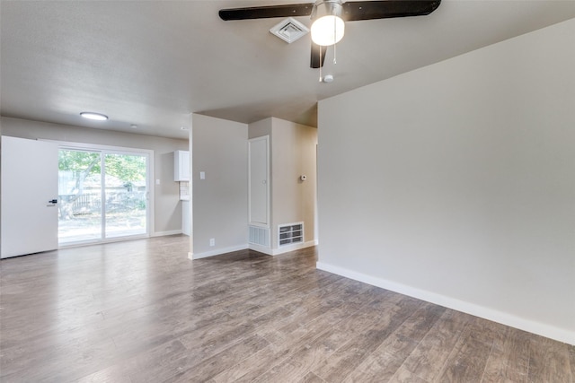 unfurnished living room featuring wood-type flooring and ceiling fan