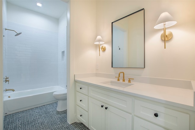 full bathroom featuring vanity, tiled shower / bath combo, toilet, and tile patterned flooring