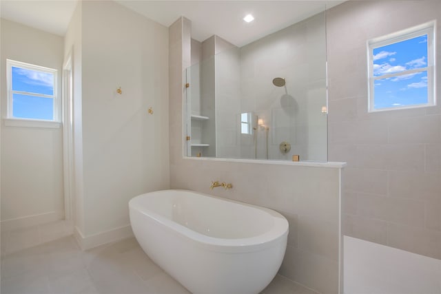 bathroom with tile patterned flooring and plus walk in shower