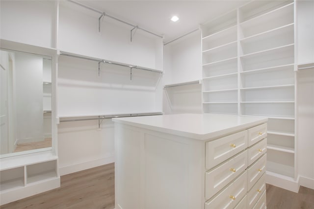 spacious closet featuring light hardwood / wood-style floors