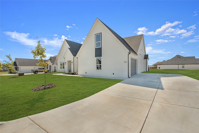 view of property exterior featuring a garage and a lawn