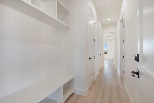 mudroom with light hardwood / wood-style flooring