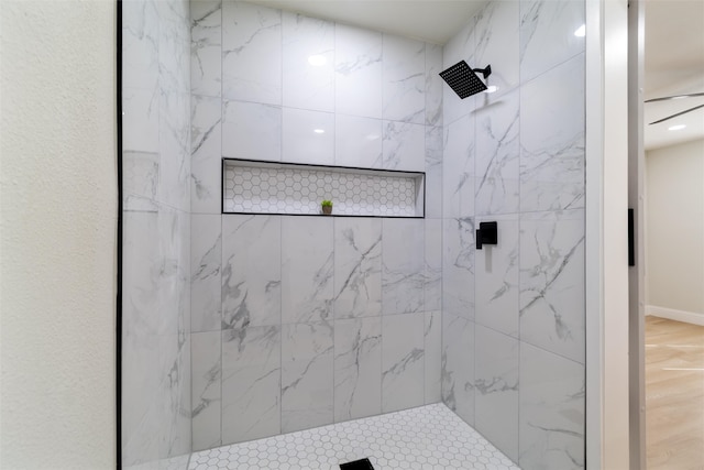 bathroom with a tile shower