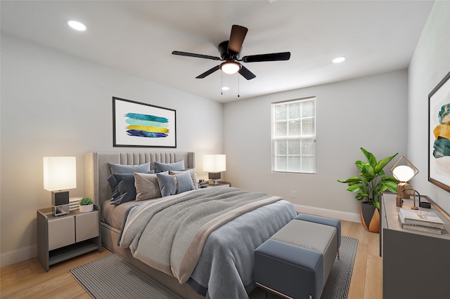 bedroom featuring light wood-type flooring and ceiling fan