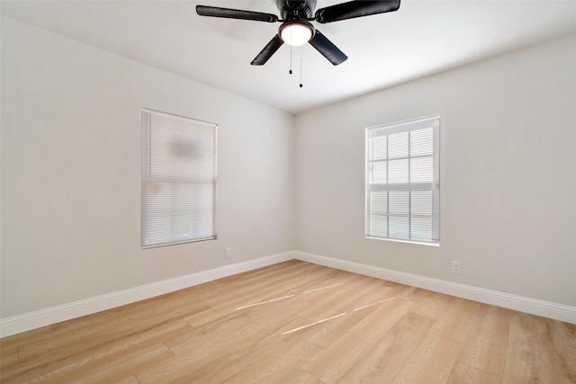 empty room featuring light hardwood / wood-style flooring and ceiling fan