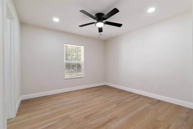 empty room with ceiling fan and light wood-type flooring