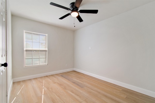 empty room featuring ceiling fan and light wood-type flooring