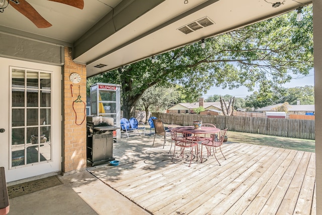 wooden deck featuring ceiling fan