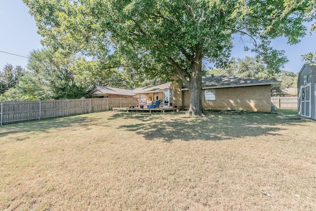 view of yard featuring a wooden deck