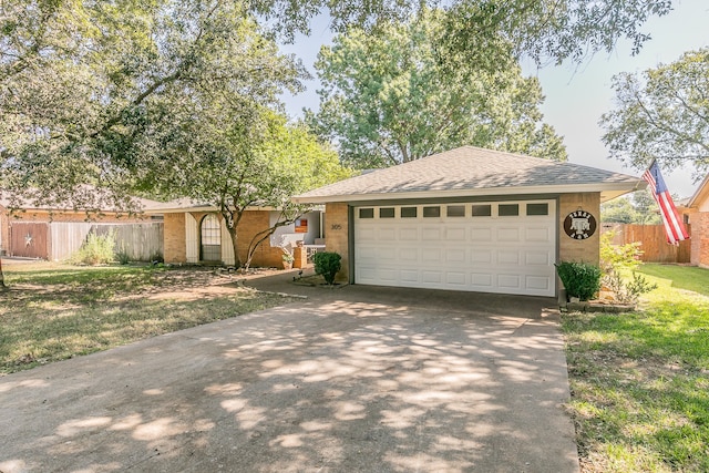 single story home with a garage and a front yard