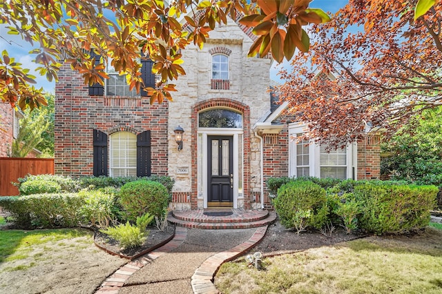 entrance to property featuring a yard