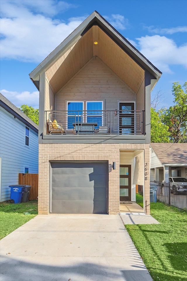 modern home featuring a front lawn, a garage, and a balcony