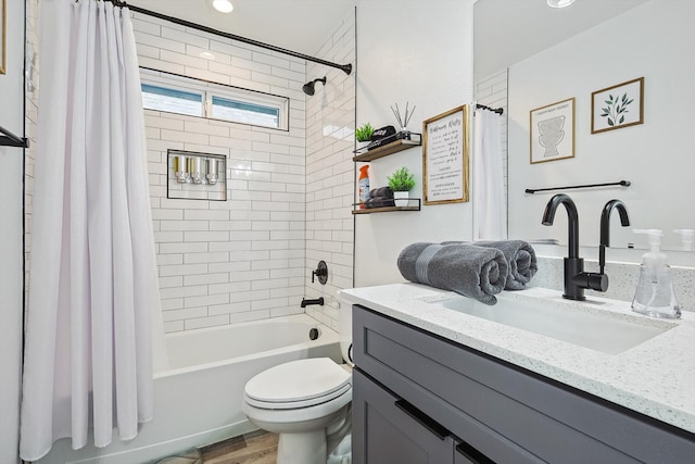 full bathroom featuring vanity, toilet, hardwood / wood-style flooring, and shower / tub combo with curtain