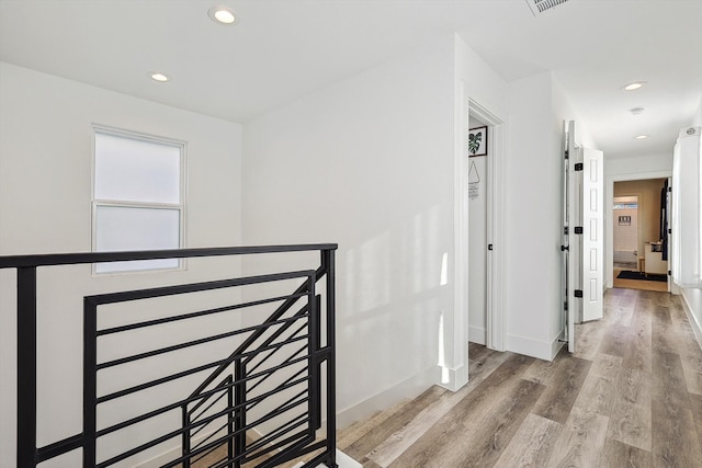 corridor featuring light hardwood / wood-style floors