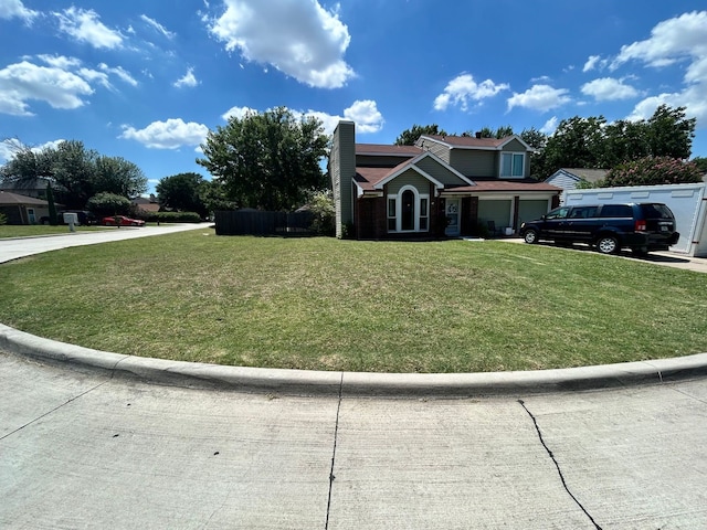 view of front facade featuring a front yard and a garage