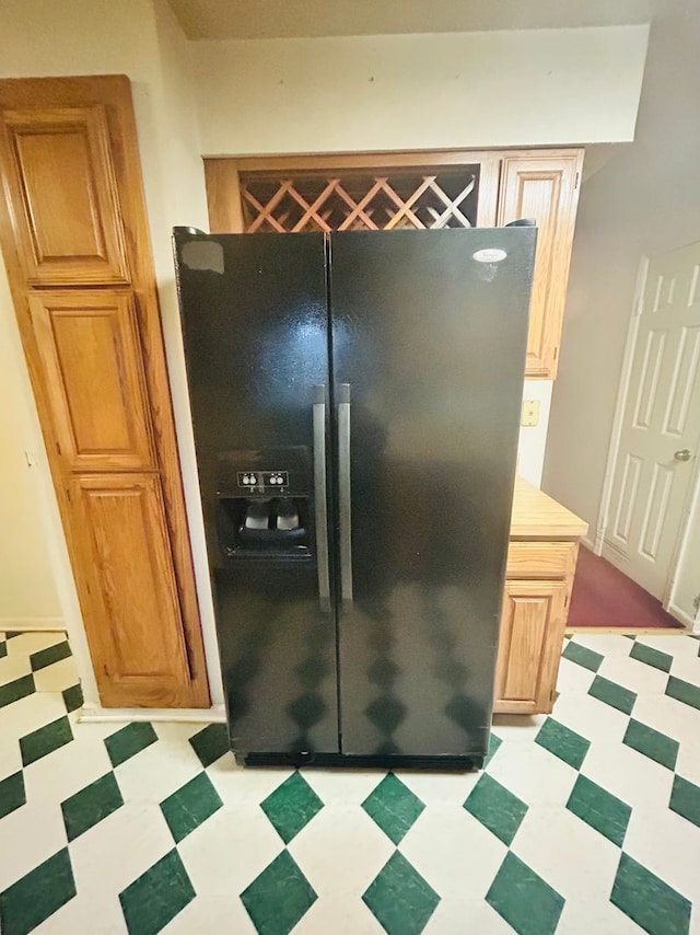 kitchen with black fridge