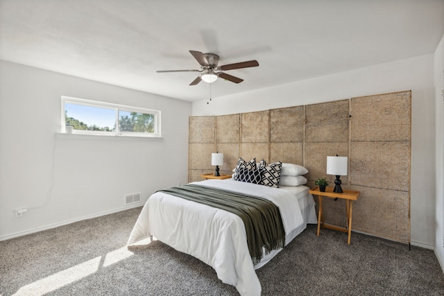 bedroom with dark colored carpet and ceiling fan