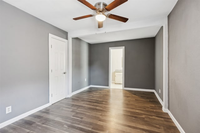 spare room featuring dark hardwood / wood-style floors and ceiling fan