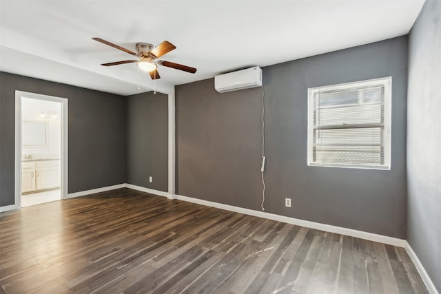 empty room featuring ceiling fan, dark wood-type flooring, and a wall mounted AC