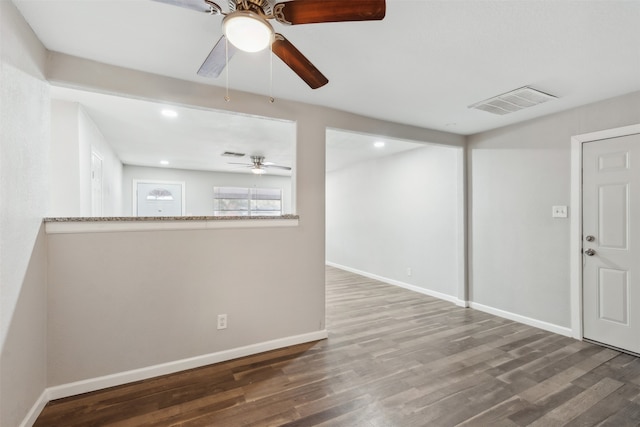 unfurnished room with wood-type flooring