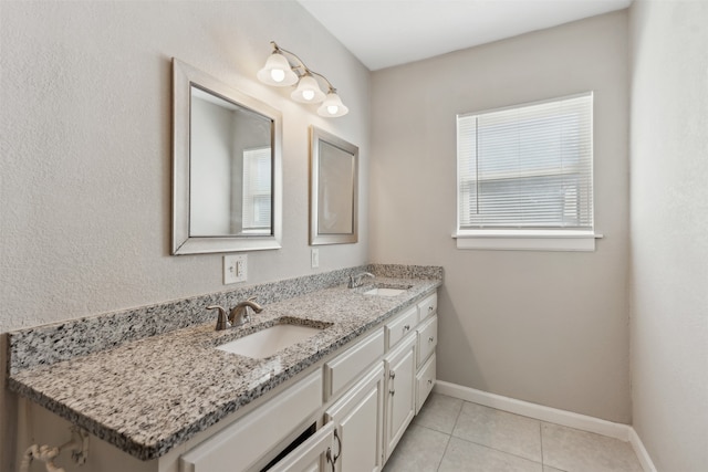 bathroom with tile patterned flooring and vanity