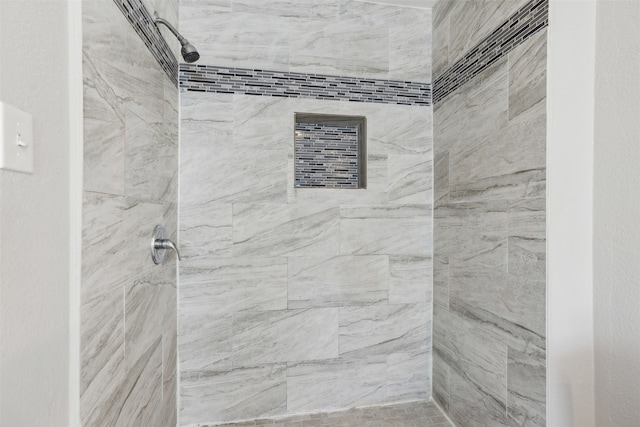 bathroom featuring tiled shower