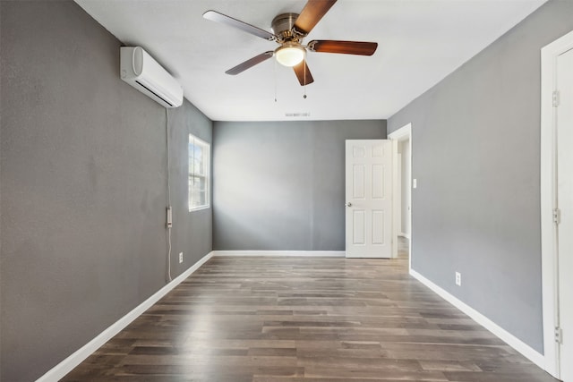 unfurnished room featuring ceiling fan, dark wood-type flooring, and a wall mounted air conditioner