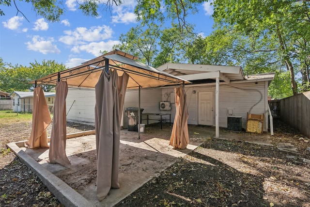 exterior space with a gazebo and central AC