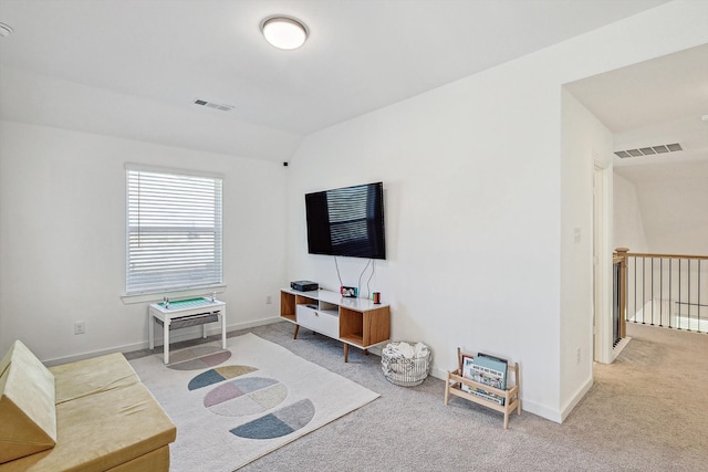 living room with carpet floors and lofted ceiling