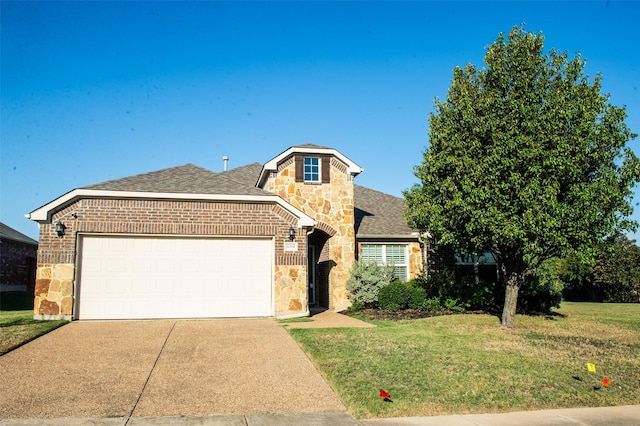 view of front facade with a front yard and a garage