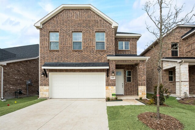 view of front facade featuring a front yard and a garage