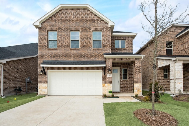 view of front facade with a garage and a front yard