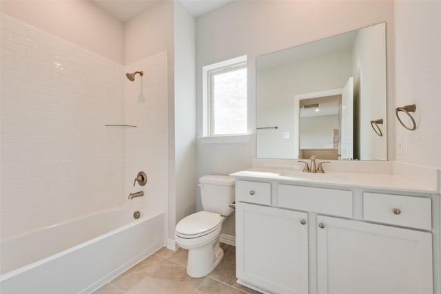 full bathroom with vanity, tile patterned floors, toilet, and tiled shower / bath