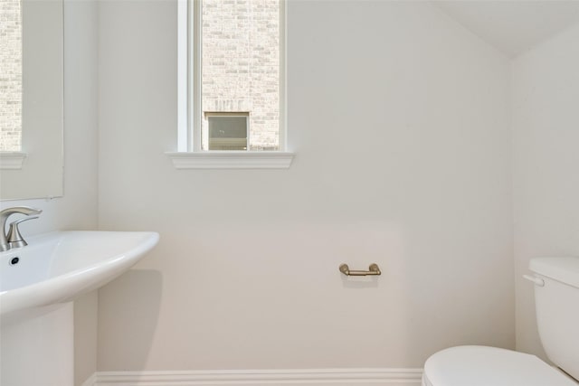 bathroom with toilet and sink