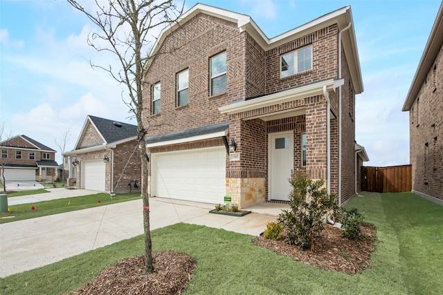 view of front of house featuring a garage and a front lawn