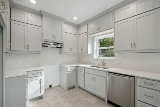 kitchen with light tile patterned floors, backsplash, stainless steel dishwasher, gray cabinetry, and sink