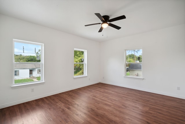 unfurnished room featuring dark hardwood / wood-style floors and ceiling fan