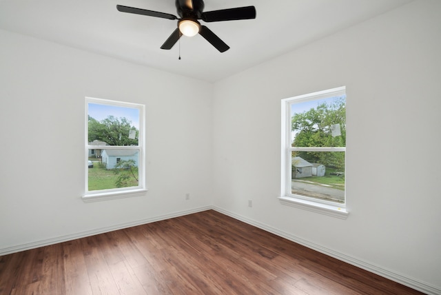 unfurnished room with hardwood / wood-style floors and ceiling fan