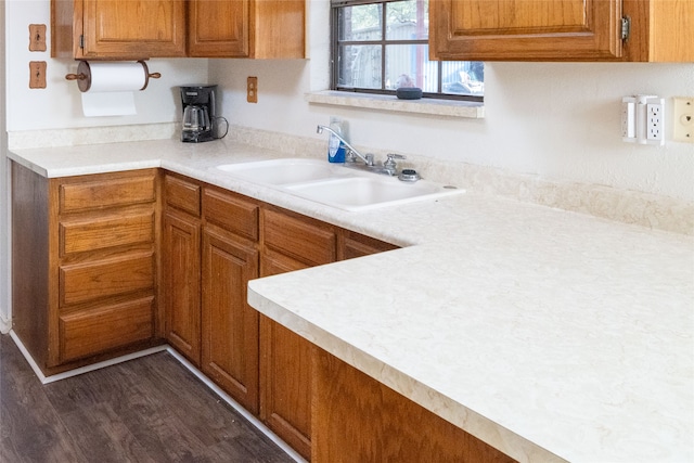 kitchen featuring sink and dark hardwood / wood-style floors