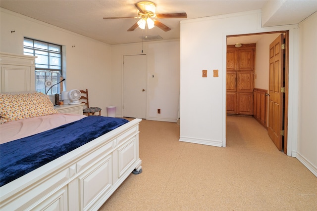 bedroom with light colored carpet and ceiling fan